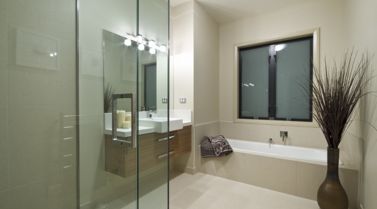 View of the bathroom of this Landmark Homes bathroom, floor, glass, interior design, property, real estate, room, gray