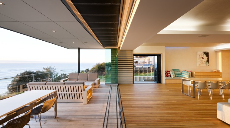 View of open-plan living space which features clay-based apartment, balcony, daylighting, estate, floor, home, house, interior design, real estate, roof, wood, orange