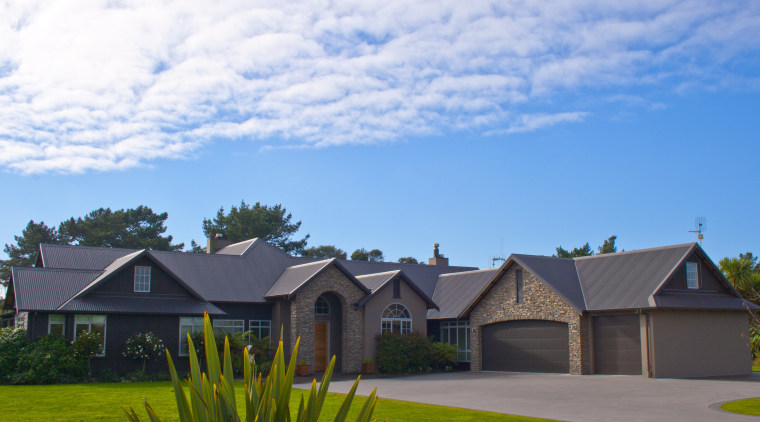 Exterior view of a home which features schist cloud, cottage, elevation, estate, facade, farmhouse, grass, home, house, land lot, landscape, property, real estate, residential area, roof, sky, suburb, teal