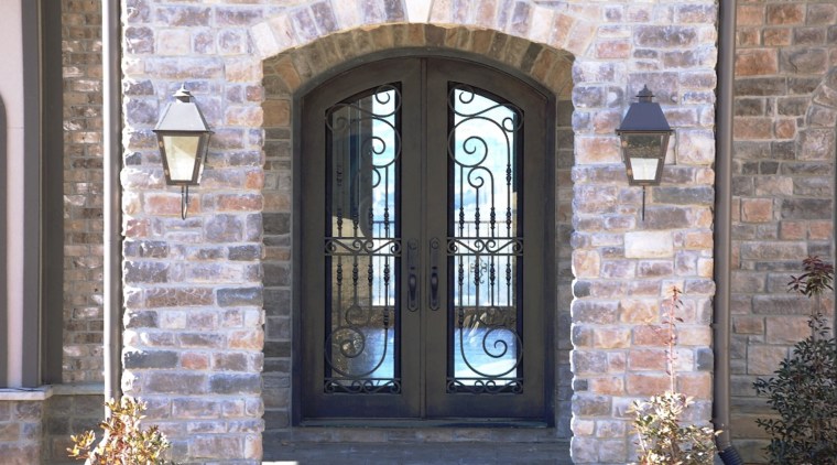 Grand entrance with brick wall &amp; iron door arch, brick, brickwork, door, facade, gate, iron, window, gray