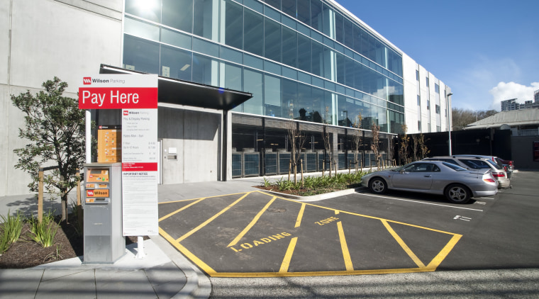 Exterior view of the carpark outside the office architecture, building, car, car dealership, commercial building, corporate headquarters, facade, family car, luxury vehicle, metropolitan area, mixed use, motor vehicle, parking, parking lot, real estate, vehicle, white