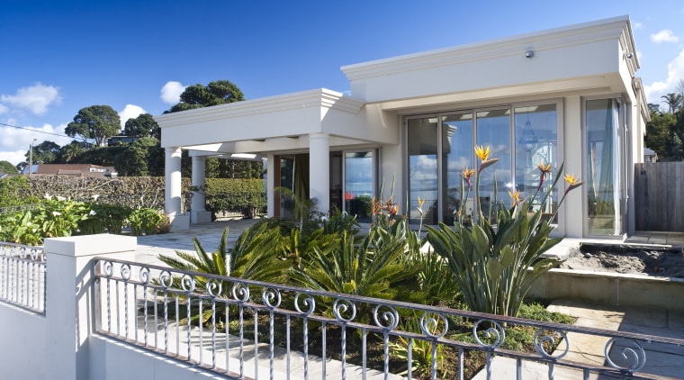 View of the exterior of this modern home cottage, estate, facade, home, house, property, real estate, villa, gray