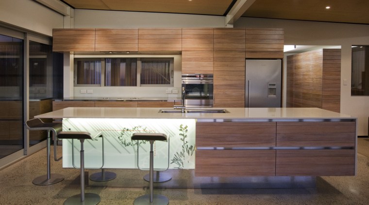 View of a kitchen which features an island cabinetry, ceiling, countertop, furniture, interior design, kitchen, wood, brown