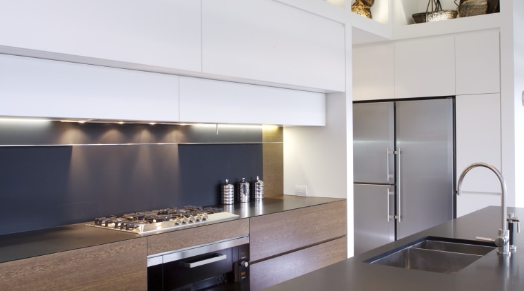 View of kitchen which features oak veneer island apartment, architecture, cabinetry, countertop, floor, flooring, hardwood, interior design, kitchen, laminate flooring, living room, room, wood, wood flooring, white