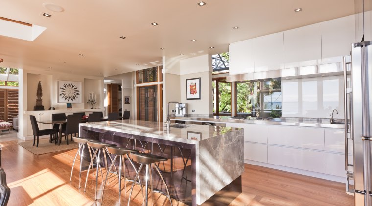 View of open-plan kitchen featuring an island with countertop, estate, interior design, kitchen, property, real estate, orange, white