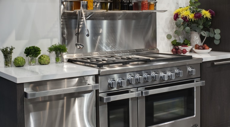 View of a kitchen which features DCS oven countertop, gas stove, home appliance, kitchen, kitchen appliance, kitchen stove, major appliance, oven, refrigerator, small appliance, gray, black