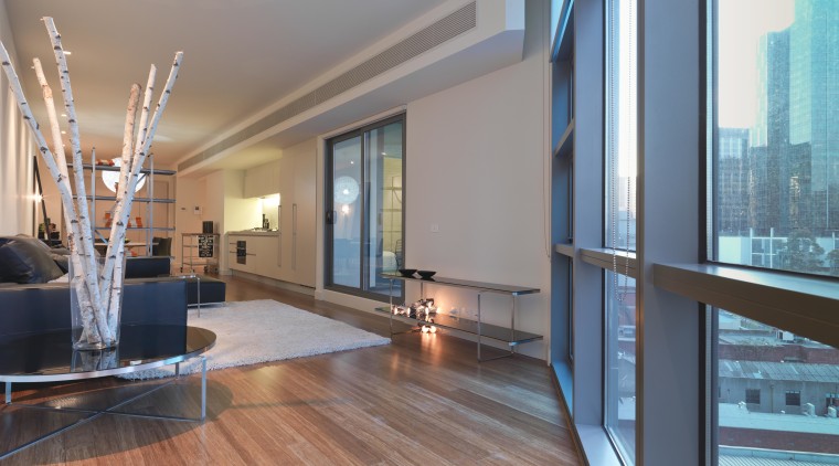 View the lounge area of an apartment at apartment, architecture, ceiling, condominium, daylighting, estate, floor, flooring, hardwood, interior design, living room, loft, penthouse apartment, property, real estate, window, wood, wood flooring, gray