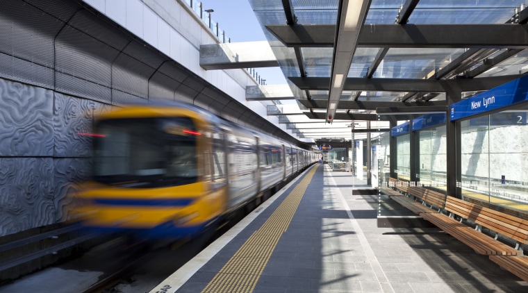 View of the upgraded New Market train station. high speed rail, metro station, metropolis, metropolitan area, mode of transport, passenger, public transport, rail transport, railroad car, rapid transit, residential area, rolling stock, track, train, train station, transport, urban area, black