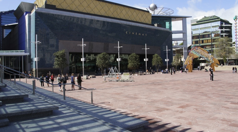 View of Aotea Square which features paving, planters, architecture, building, campus, city, downtown, metropolitan area, mixed use, neighbourhood, plaza, public space, structure, town square, urban design, black, gray