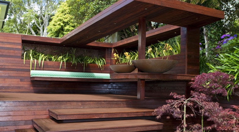 View of timber outdoor seating area with large backyard, home, house, outdoor structure, plant, tree, wood, red