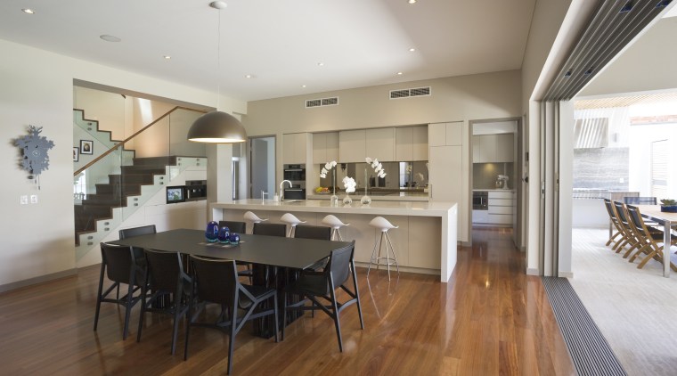 View of large, open renovated kitchen featuring timber ceiling, dining room, floor, flooring, hardwood, house, interior design, kitchen, property, real estate, room, wood flooring, gray, brown