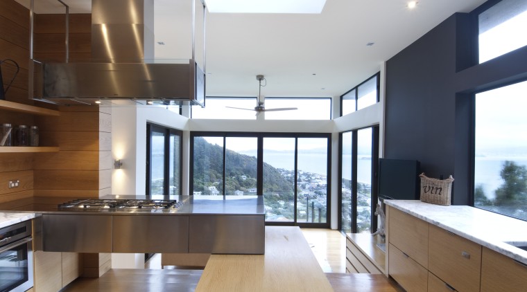 View of kitchen which features oak floors, and architecture, countertop, daylighting, interior design, kitchen, real estate, white, brown