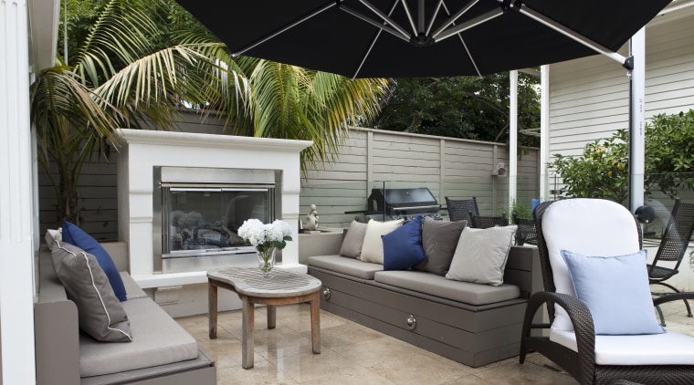 View of outdoor area with pool, paving, fountain, backyard, furniture, home, interior design, living room, outdoor structure, patio, property, real estate, gray, black