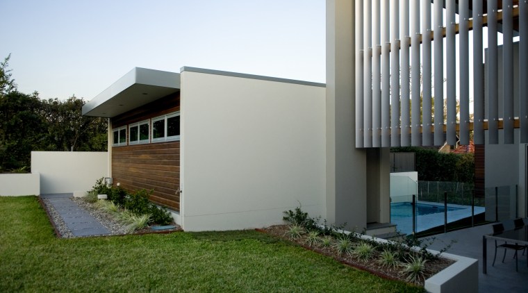 View of home with double height entrance, deck architecture, backyard, estate, facade, home, house, property, real estate, residential area, siding, yard, gray