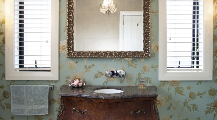 View of bathroom with floral wallpaper and dark-toned antique, bathroom accessory, chest of drawers, furniture, home, interior design, room, table, window, white, gray, brown
