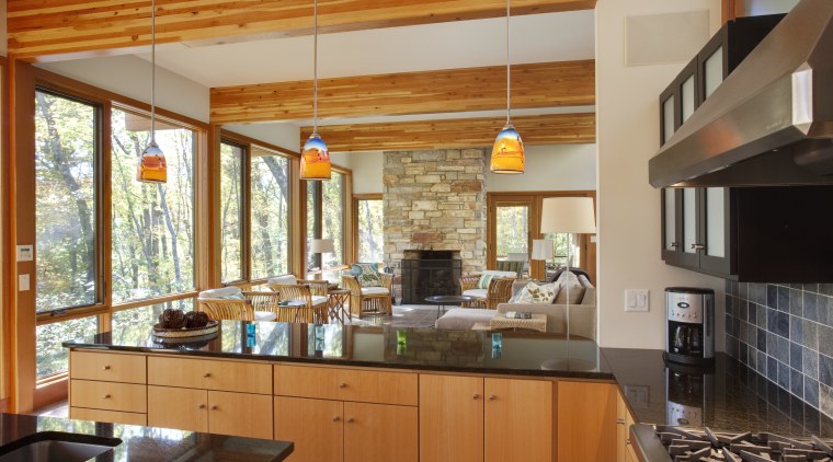 View of sunken open-plan kitchen with wooden cabinetry, cabinetry, ceiling, countertop, cuisine classique, interior design, kitchen, real estate, brown
