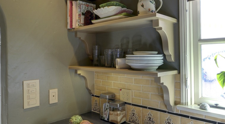 View of Spanish-style home with open shelving and cabinetry, countertop, furniture, home, house, interior design, kitchen, room, shelf, wall, brown, gray