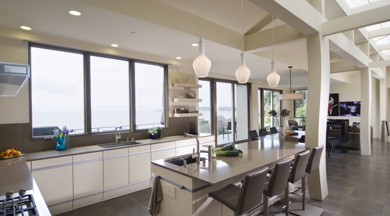 View of neutral-toned kitchen and dining space, featuring countertop, interior design, kitchen, property, real estate, window, gray