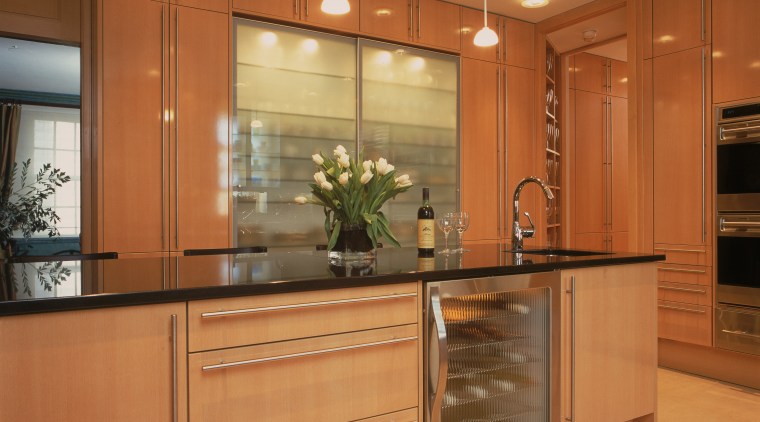 View of remodeled kitchen in a Park Avenue cabinetry, countertop, cuisine classique, hardwood, interior design, kitchen, room, under cabinet lighting, orange, brown