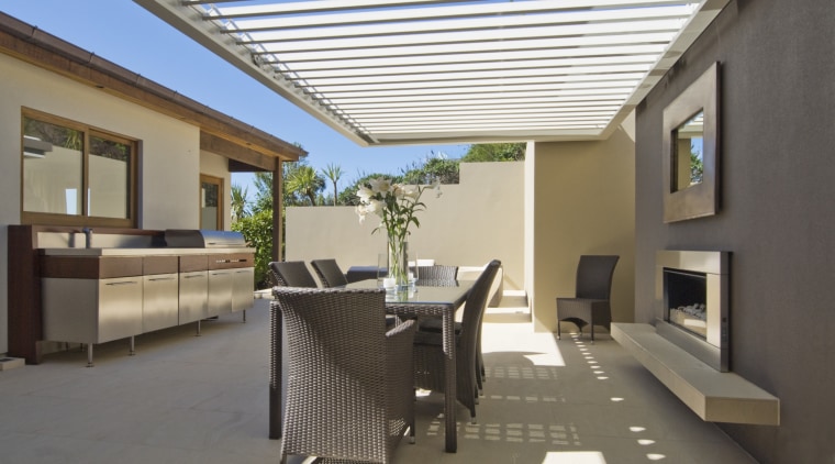 View of outdoor area with contemporary dark-toned furniture. daylighting, estate, house, interior design, patio, property, real estate, roof, window, gray