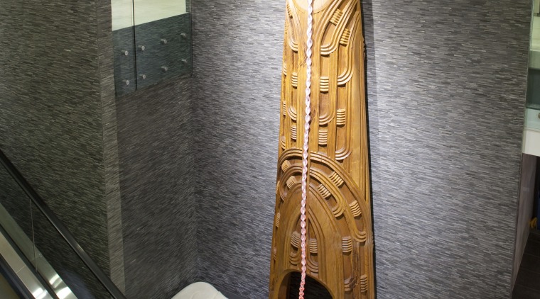 View of Maori carving in the entrance foyer flooring, interior design, gray, black