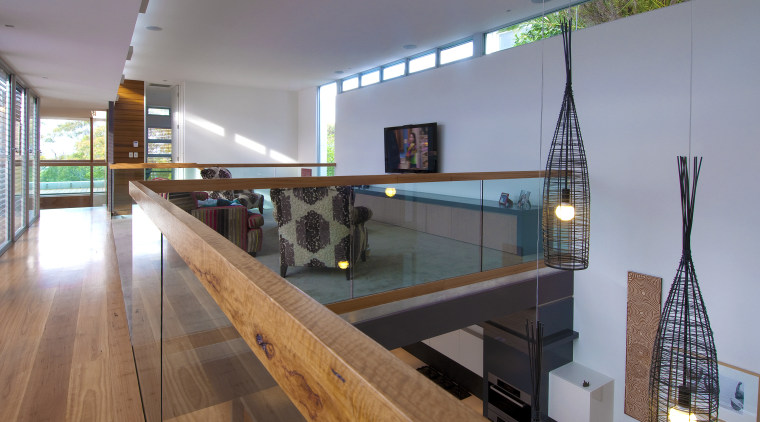 View of mezzanine area with wooden floor and glass, handrail, interior design, gray
