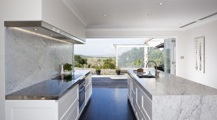 Carrara marble is used to create a centerpiece architecture, countertop, daylighting, estate, home, house, interior design, kitchen, property, real estate, gray