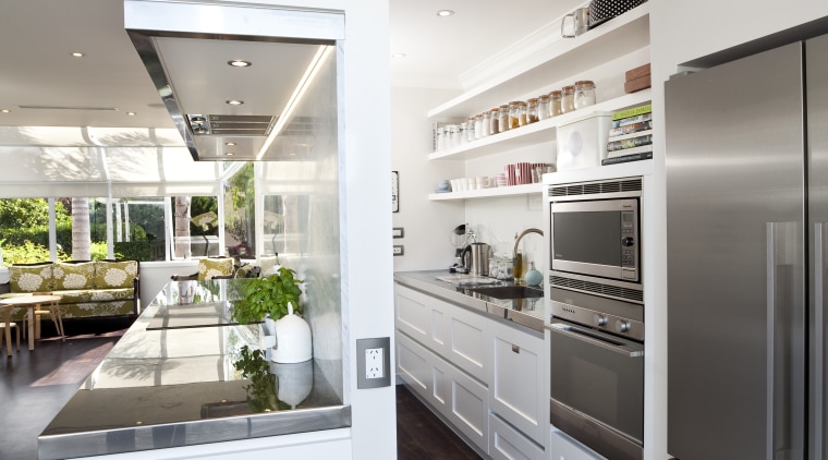 The kitchen is designed by Robyn Labb Kitchens. countertop, home appliance, interior design, kitchen, refrigerator, gray