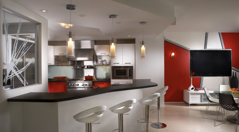 Interior view of contemporary apartment with red feature countertop, interior design, kitchen, real estate, gray