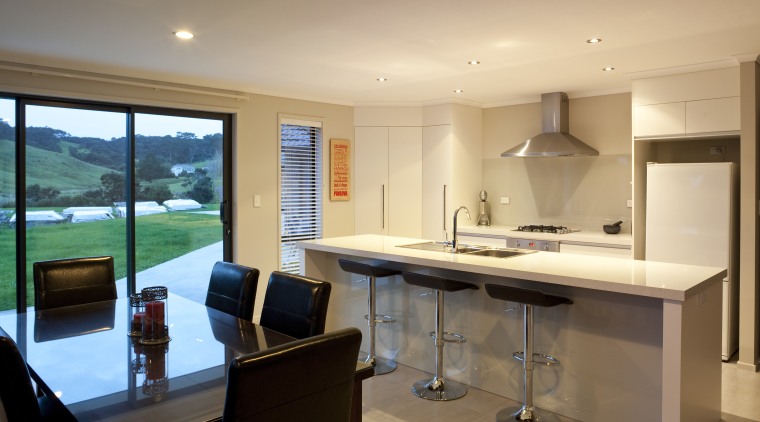 View of light-toned kitchen with breakfast bar. - interior design, kitchen, property, real estate, room, orange