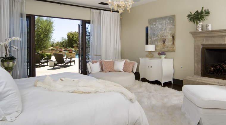 This master suite was designed by Martin Horner bed frame, bed sheet, bedroom, estate, floor, home, interior design, living room, property, real estate, room, suite, window, gray