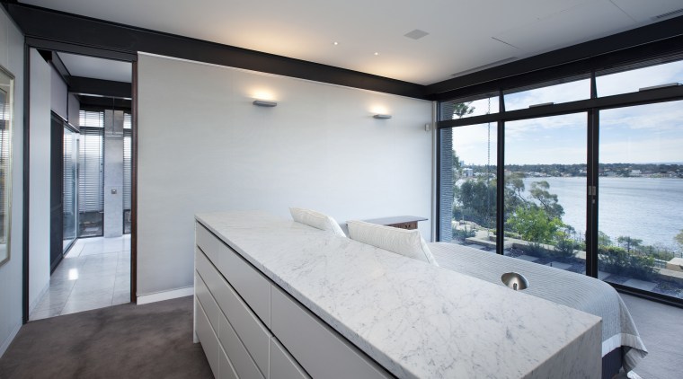 The master bed in this modern master suite apartment, architecture, estate, house, interior design, property, real estate, room, window, gray