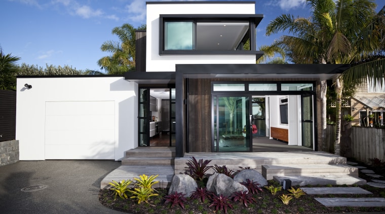 This new house was designed by Richard Furze architecture, elevation, facade, home, house, property, real estate, window, black