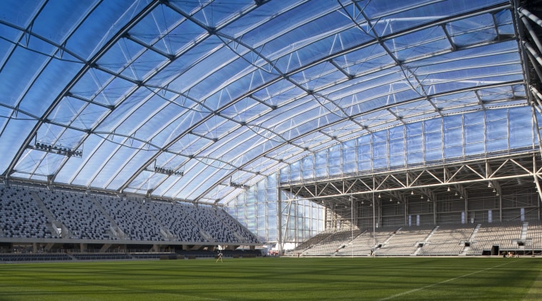 Anderson Lloyd provided the legal support necessary for architecture, arena, atmosphere, atmosphere of earth, corporate headquarters, daylighting, daytime, grass, sky, soccer specific stadium, sport venue, stadium, structure, teal