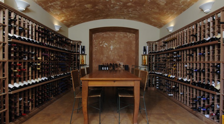 This house was designed by Mark Wilson of institution, library, liquor store, public library, wine cellar, winery, brown