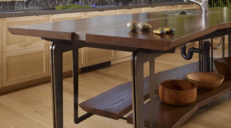 This home and kitchen was designed by Finne coffee table, floor, flooring, furniture, hardwood, table, wood, wood flooring, wood stain, brown