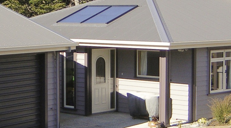 This large home efficiently uses solar energy thanks home, house, property, real estate, roof, siding, window, gray, black