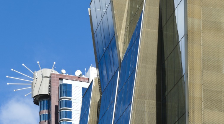 Here is a view of the new Telecom architecture, building, city, commercial building, condominium, corporate headquarters, daytime, facade, headquarters, landmark, metropolis, metropolitan area, sky, skyscraper, tower, tower block, urban area, teal