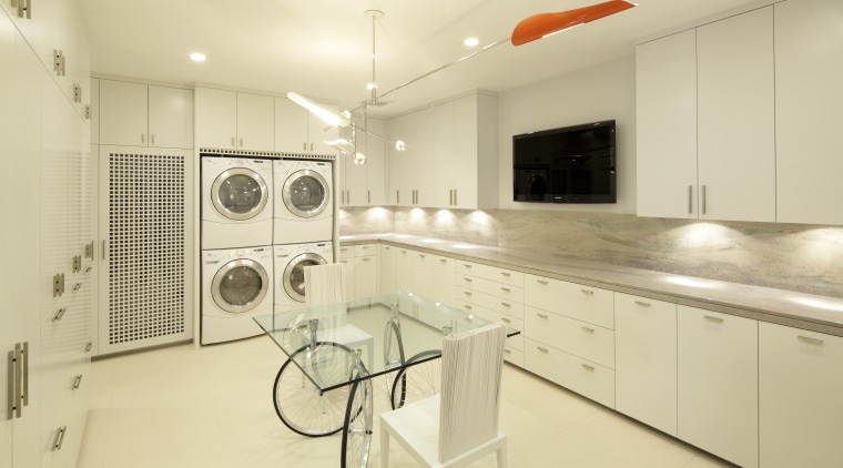 View of white laundry with white cabinetry, contemporary cabinetry, countertop, home, interior design, kitchen, laundry room, property, real estate, room, yellow