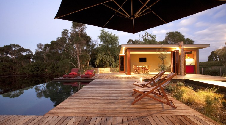 View of patio area. - View of patio backyard, cottage, deck, estate, home, house, outdoor structure, property, real estate, villa