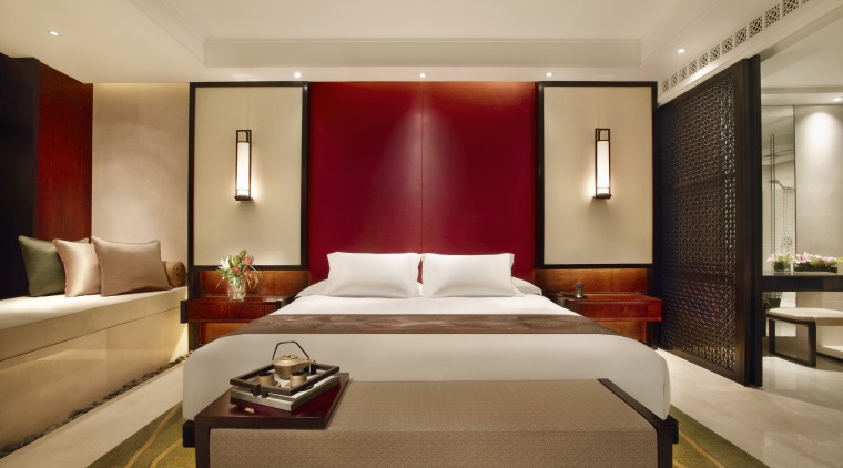 Bedroom with white bed and red feature wall. bed frame, bedroom, ceiling, hotel, interior design, room, suite, wall, orange