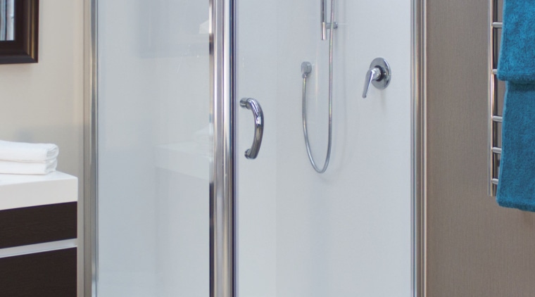 Shower enclosure with grey flooring. - Shower enclosure plumbing fixture, shower, gray