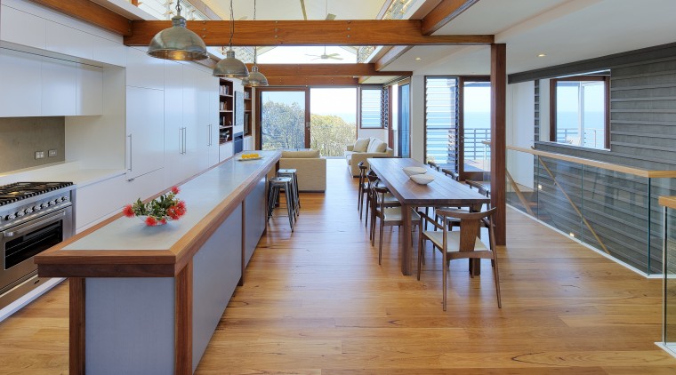 Open-plan kitchen and living area in a hilltop floor, flooring, hardwood, interior design, real estate, table, wood, wood flooring, gray