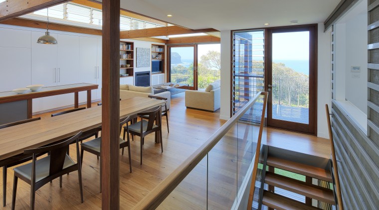Stairs lead up to this open-plan kitchen and floor, house, interior design, real estate, window, wood, gray