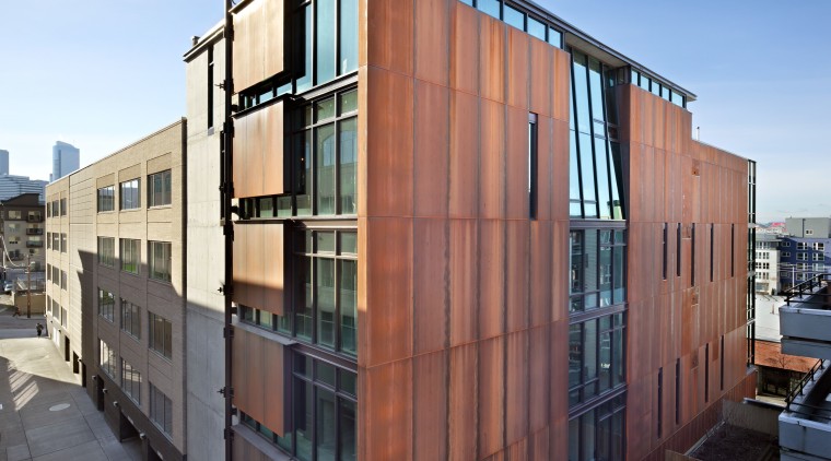 Exterior with red walls. - Exterior with red apartment, architecture, building, commercial building, condominium, corporate headquarters, facade, home, house, mixed use, neighbourhood, real estate, residential area, sky, window, black, teal