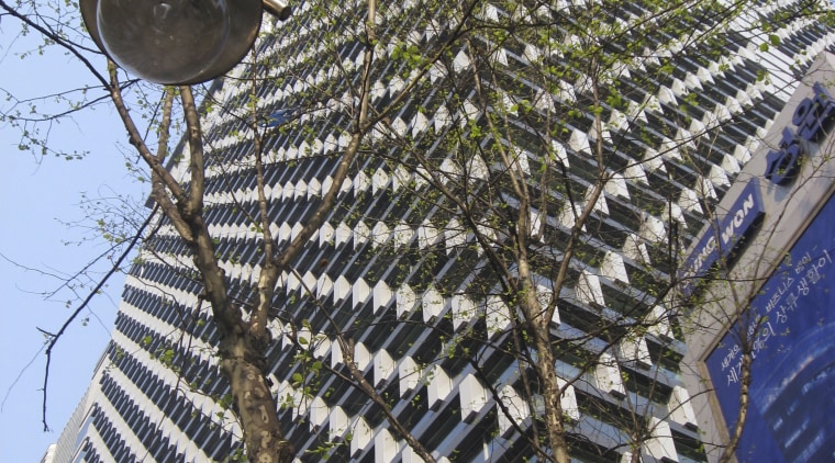 Low angle shot of office building. - Low architecture, building, facade, outdoor structure, roof, tree, black