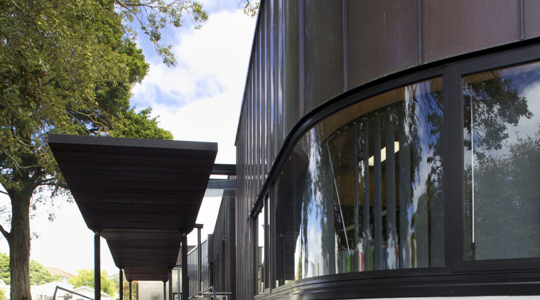 Exterior with curved windows. - Exterior with curved architecture, building, facade, house, reflection, tree, black, gray