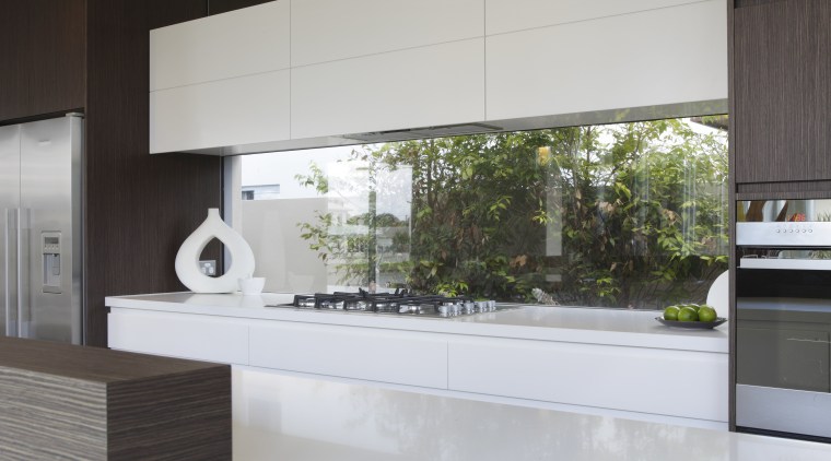 The overhead cabinets in this modern white kitchen architecture, countertop, interior design, kitchen, product design, gray, white