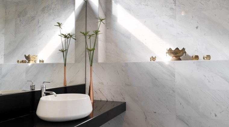 This powder room by Kun Lim Architect follows architecture, bathroom, ceiling, daylighting, floor, flooring, house, interior design, room, tile, wall, gray
