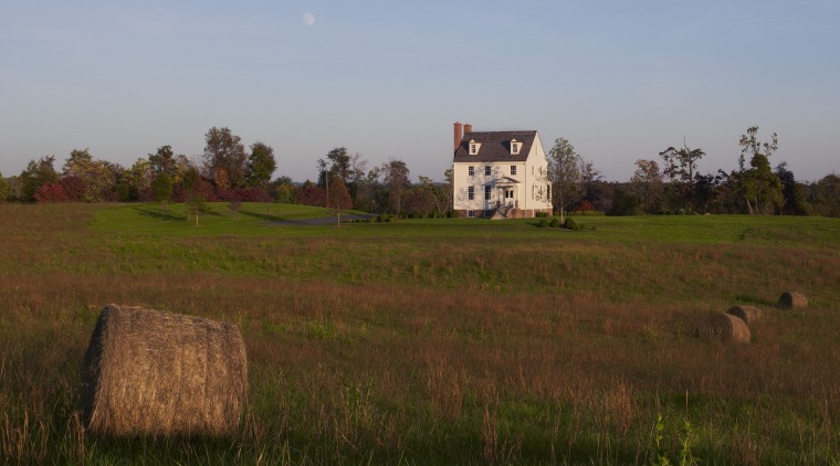 This home was built by Tom Glass of cloud, farm, farmhouse, field, grass, grass family, grassland, hill, house, land lot, meadow, pasture, plain, prairie, rural area, sky, tree, village, brown
